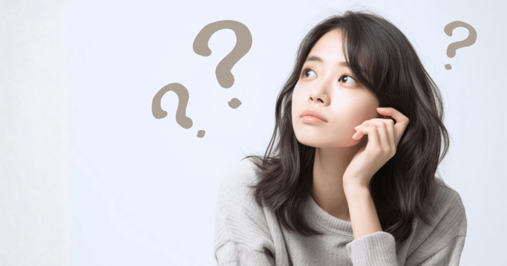 歯の痛みが出たり引いたりする原因に悩む女性のイメージ画像